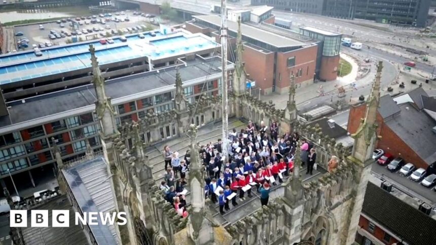 School choir sings on top of Hull Minster tower