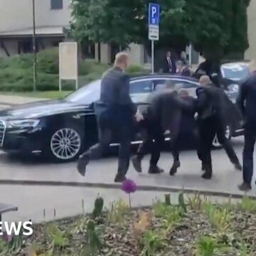 Slovak PM Robert Fico carried to car after being shot