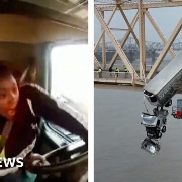 New video shows crash that left truck dangling off bridge