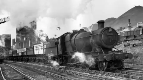 Getty Images A steam train steams down the line in south Wales