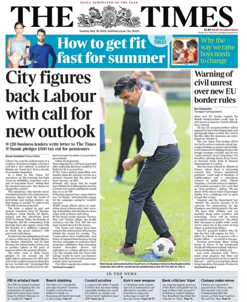 The headline on the front page of the Times reads: "City figures back Labour with call for new outlook". The paper's main image is of Rishi Sunak playing football. 