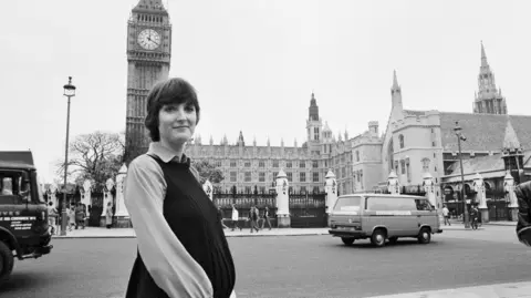 Getty Images Harriet Harman standing outside the Houses of Parliament while pregnant in 1982