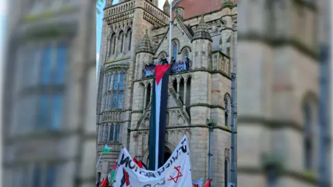 Manchester Leftist Action  Occupiers on the balcony of the Whitworth building