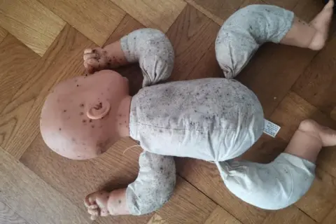 Zoe Godrich Doll covered in mould