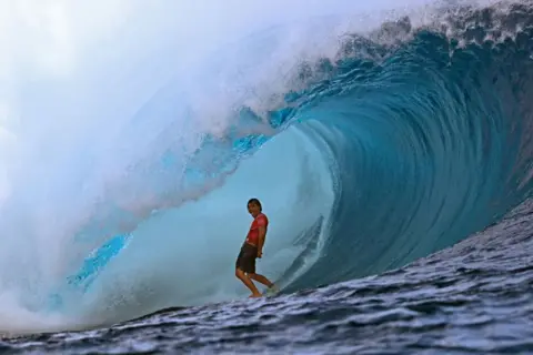 JEROME BROUILLET/AFP USA's surfer Barron Mamiya competes in the men's Shiseido Tahiti Pro surfing competition elimination round, in Teahupo'o, on the French Polynesian Island of Tahiti, on 29 May 2024.