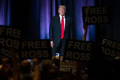  Jim WATSON / AFP Former US President Donald Trump on stage at the Libertarian National Convention