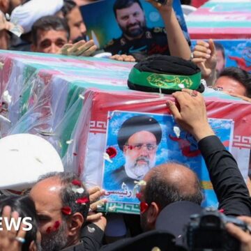 Iran burying late president at shrine in Mashhad