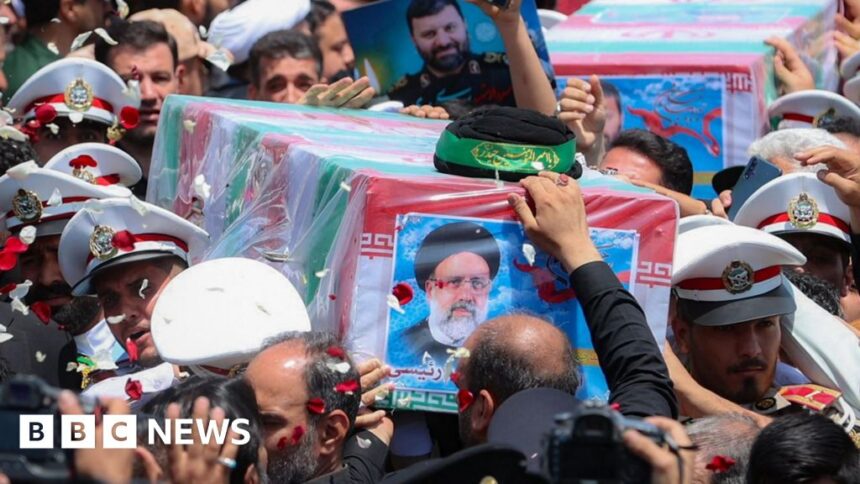 Iran burying late president at shrine in Mashhad