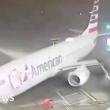 Strong winds push parked plane away from airport gate