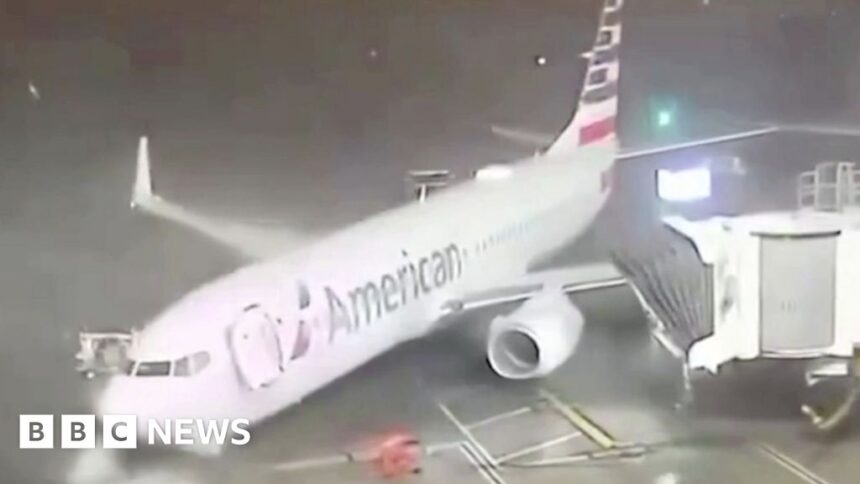 Strong winds push parked plane away from airport gate