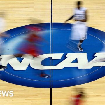 NCAA votes to approve payments to student athletes