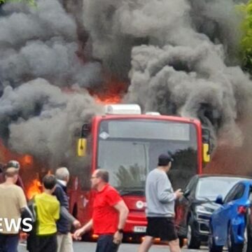 Bus bursts into flames on busy street