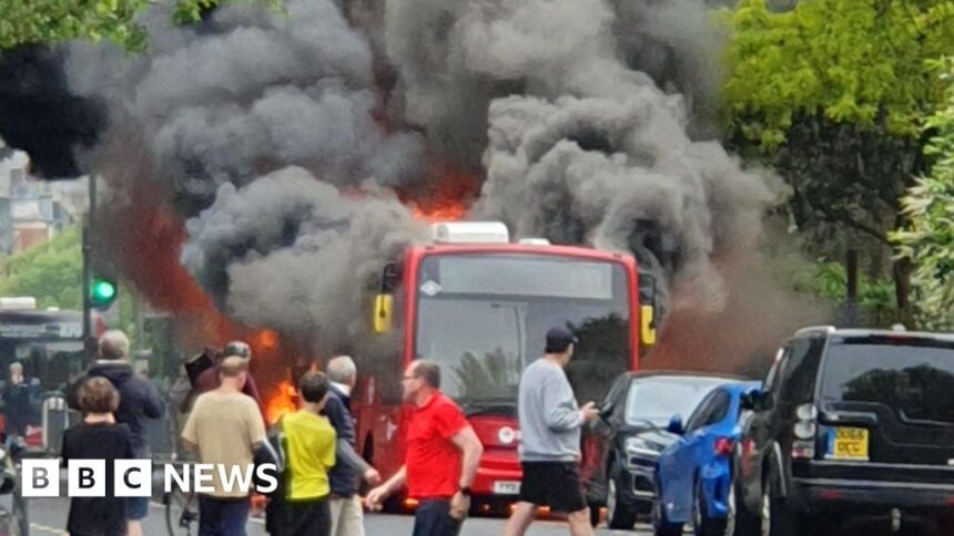 Bus bursts into flames on busy street