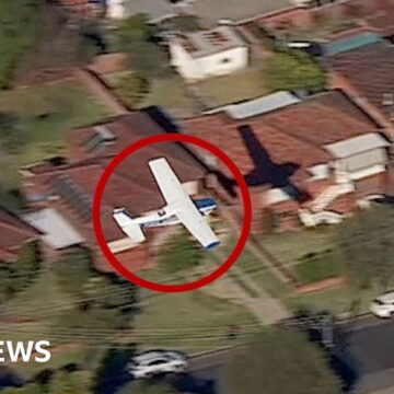 Light plane glides near homes before crash landing in Australia