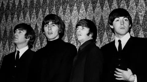 PA Media The Beatles - (Left to right) John Lennon, George Harrison, Ringo Starr and Paul McCartney, at a press conference before a show in Gaumont, Kilburn.