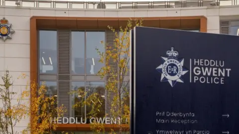 Getty Images Headquarters of Gwent Police, with a blue sign reading Heddlu Gwent Police and a window behind