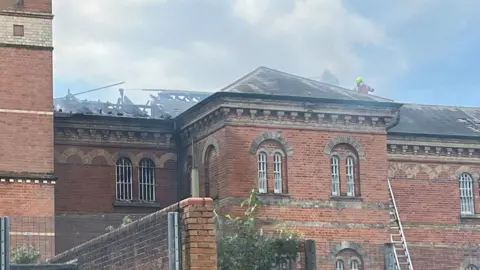 Royal Berkshire Fire and Rescue Service roof of former Broadmoor Hospital building which has been burnt