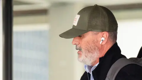 PA Media Roy Keane wearing a cap