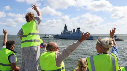 LPhot Belinda Alker People waving off HMS Duncan as it sets off from Portsmouth