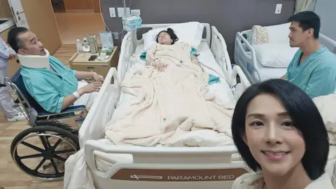 Eva Khoo Eva Khoo at the hospital in Bangkok with her family members who were on the SQ321 flight