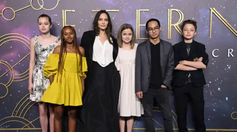 Getty Images  Shiloh Jolie-Pitt, Zahara Jolie-Pitt, Angelina Jolie, Vivienne Jolie-Pitt, Maddox Jolie-Pitt and Knox Jolie-Pitt attend the "The Eternals" UK Premiere.