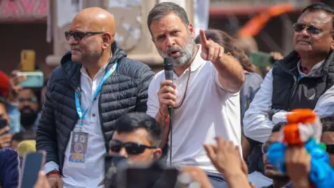 Getty Images VARANASI, INDIA - FEBRUARY 17: India's Congress Party leader Rahul Gandhi (sitting atop a vehicle, wearing white) takes part in a roadshow as part of his 'Bharat Jodo Nyay Yatra' (India Come Together Anew Tour) on February 17, 2024 in Varanasi, India