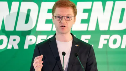 PA Media Green MSP Ross Greer talking